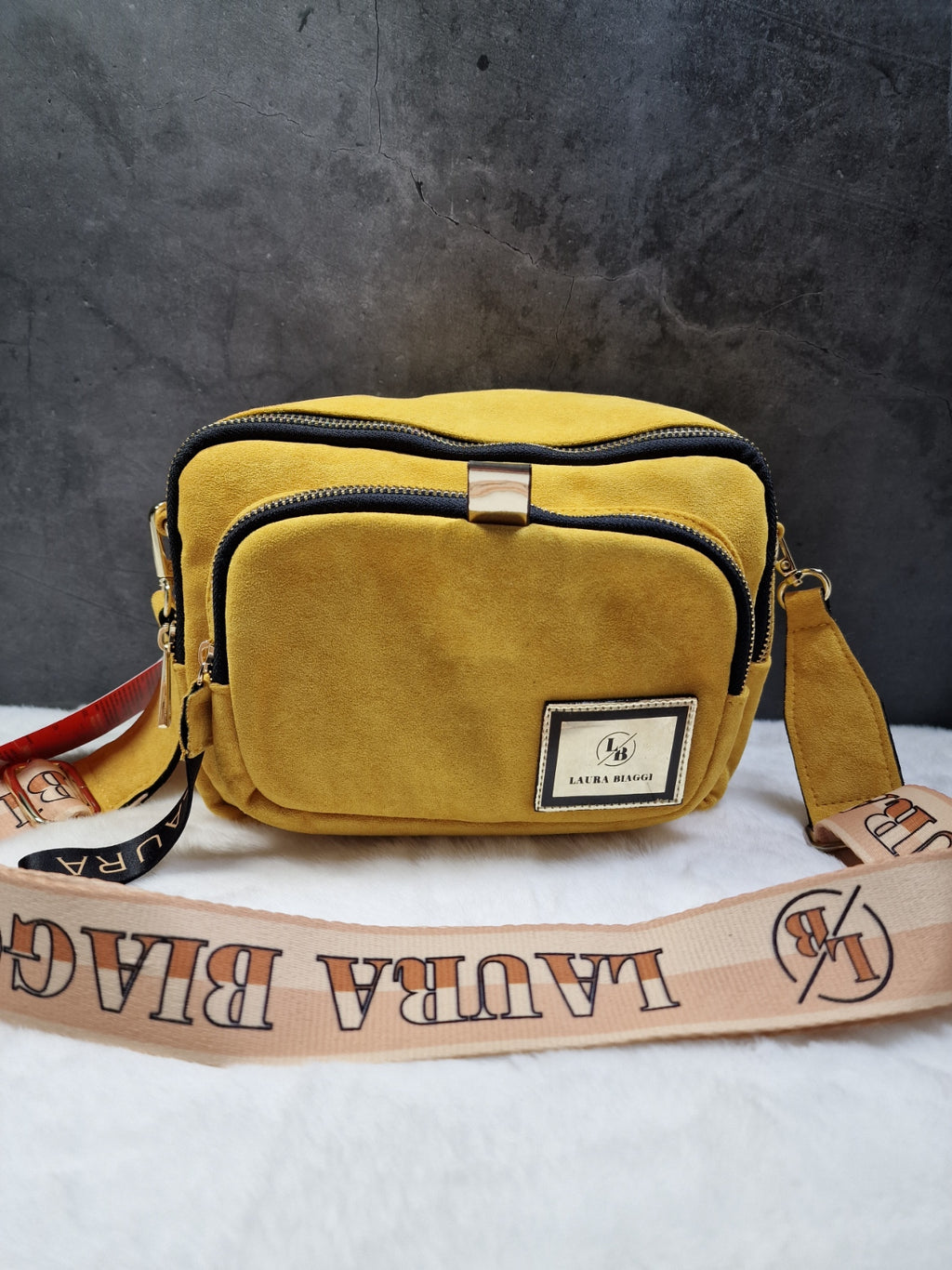 Laura Biaggi small, cross body bag in mustard image 0