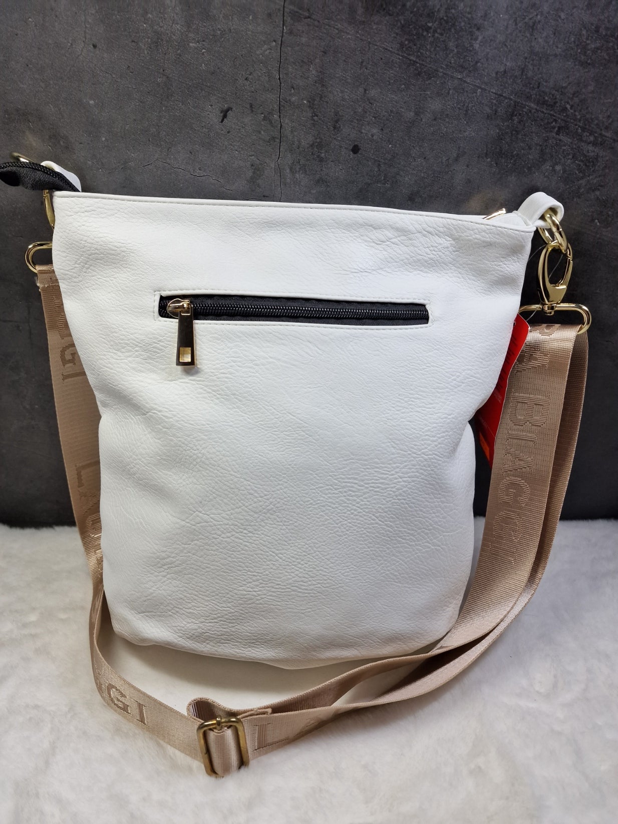 Laura Biaggi cross body bag in white image 1