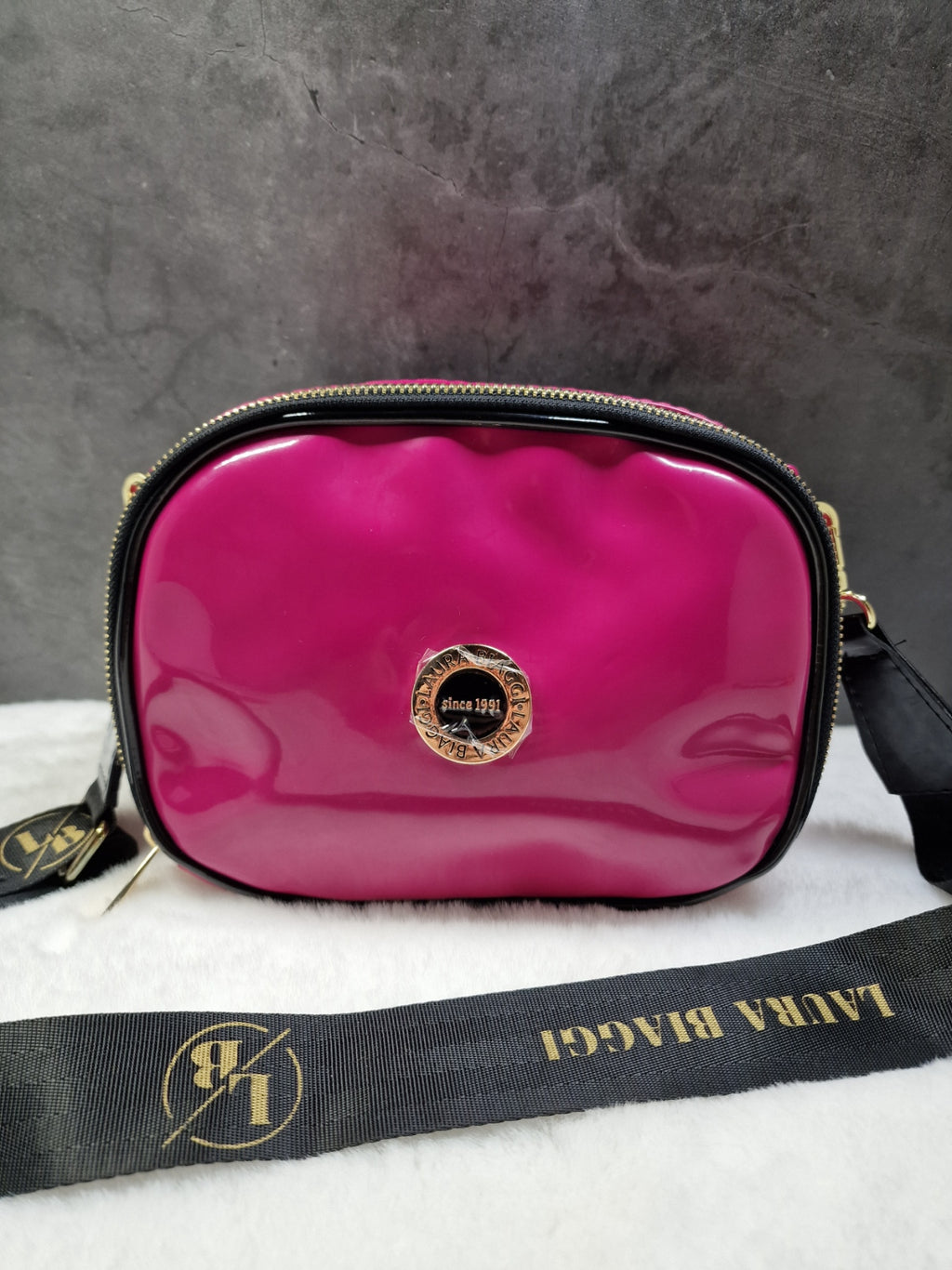 Laura Biaggi small, cross body bag in fuchsia image 0