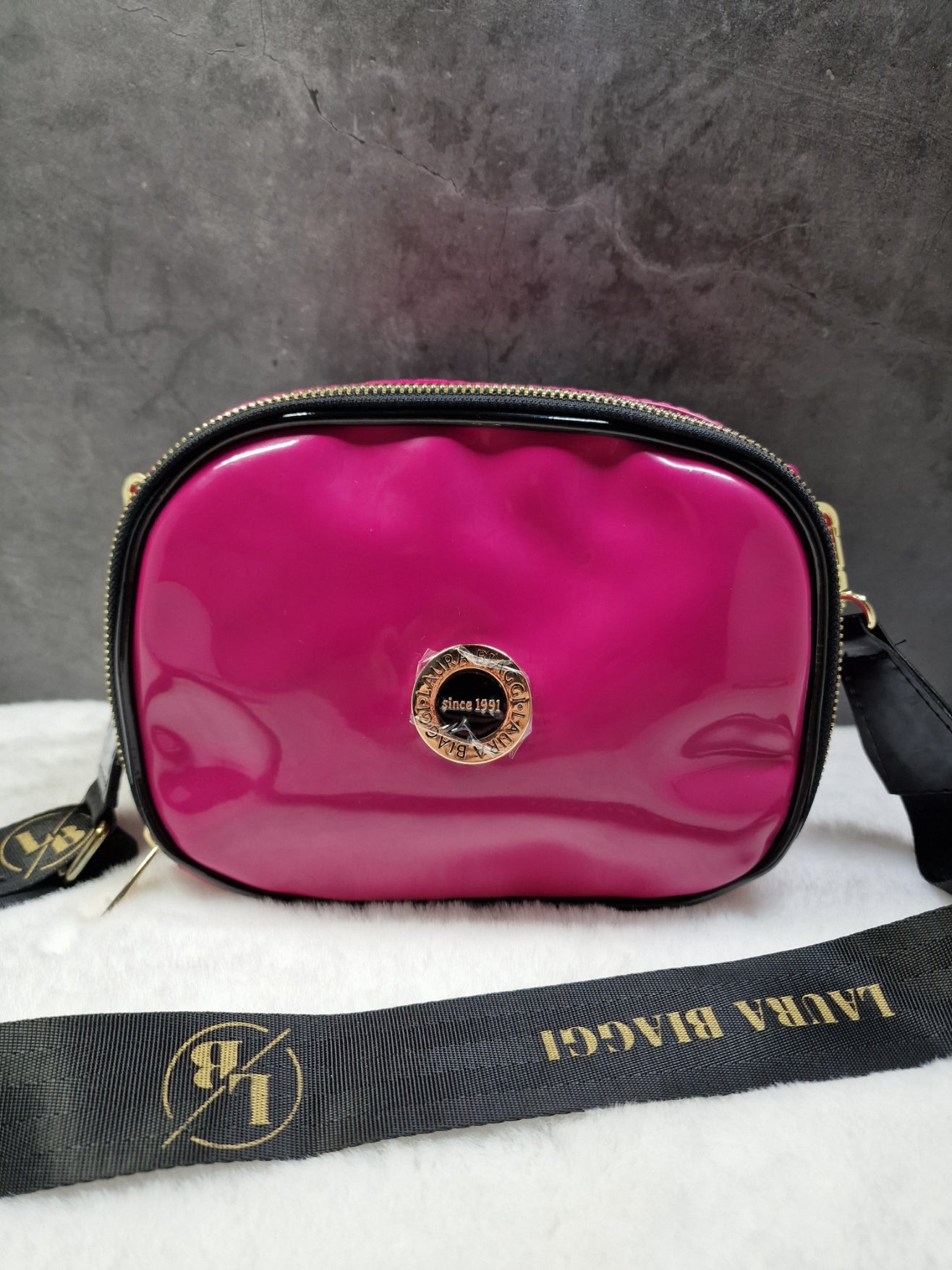 Laura Biaggi small, cross body bag in fuchsia image 0