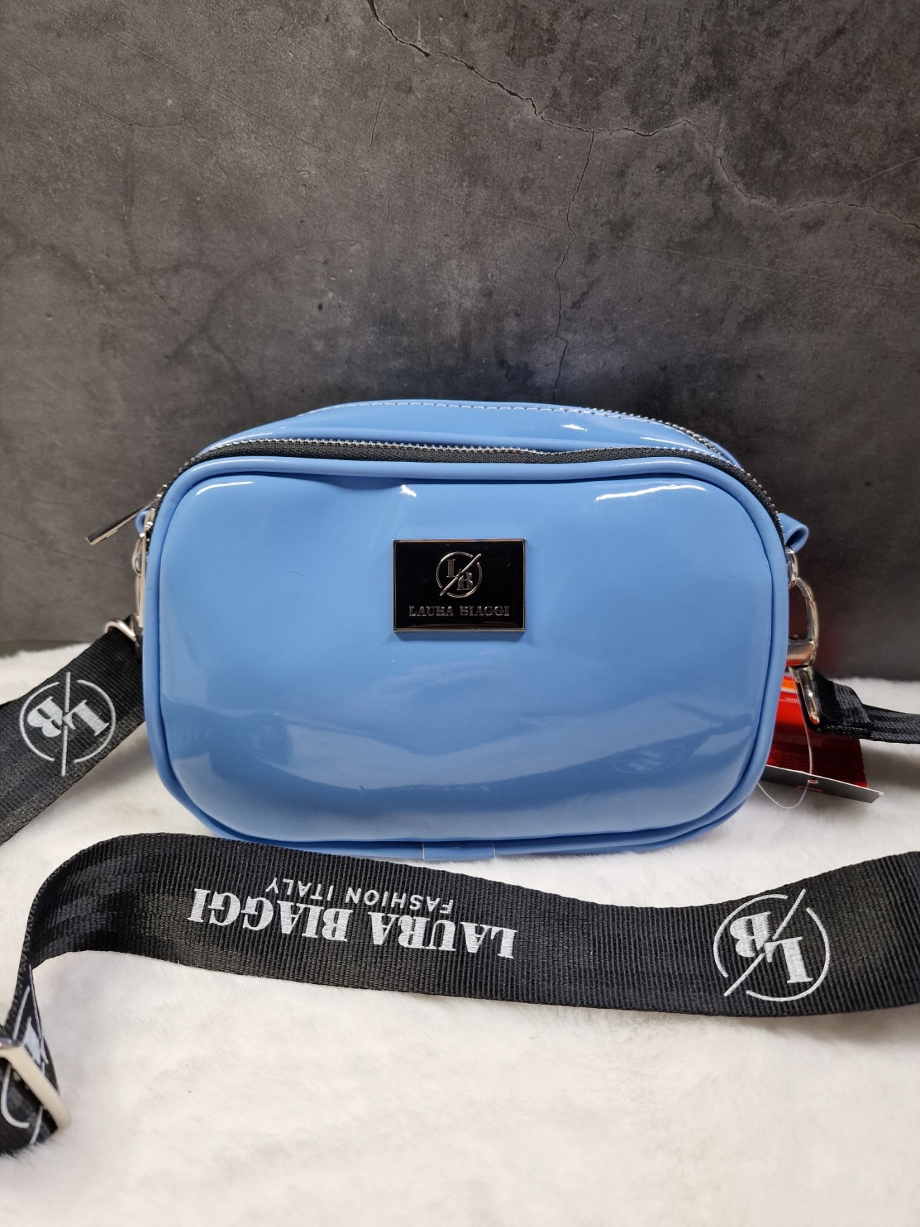 Laura Biaggi small, cross body bag in blue image 0