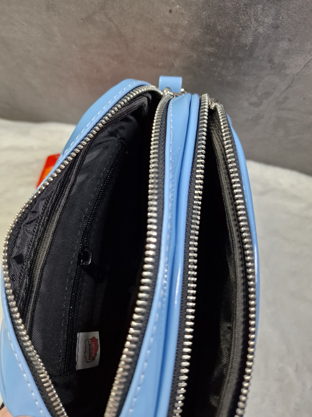 Laura Biaggi small, cross body bag in blue image 2