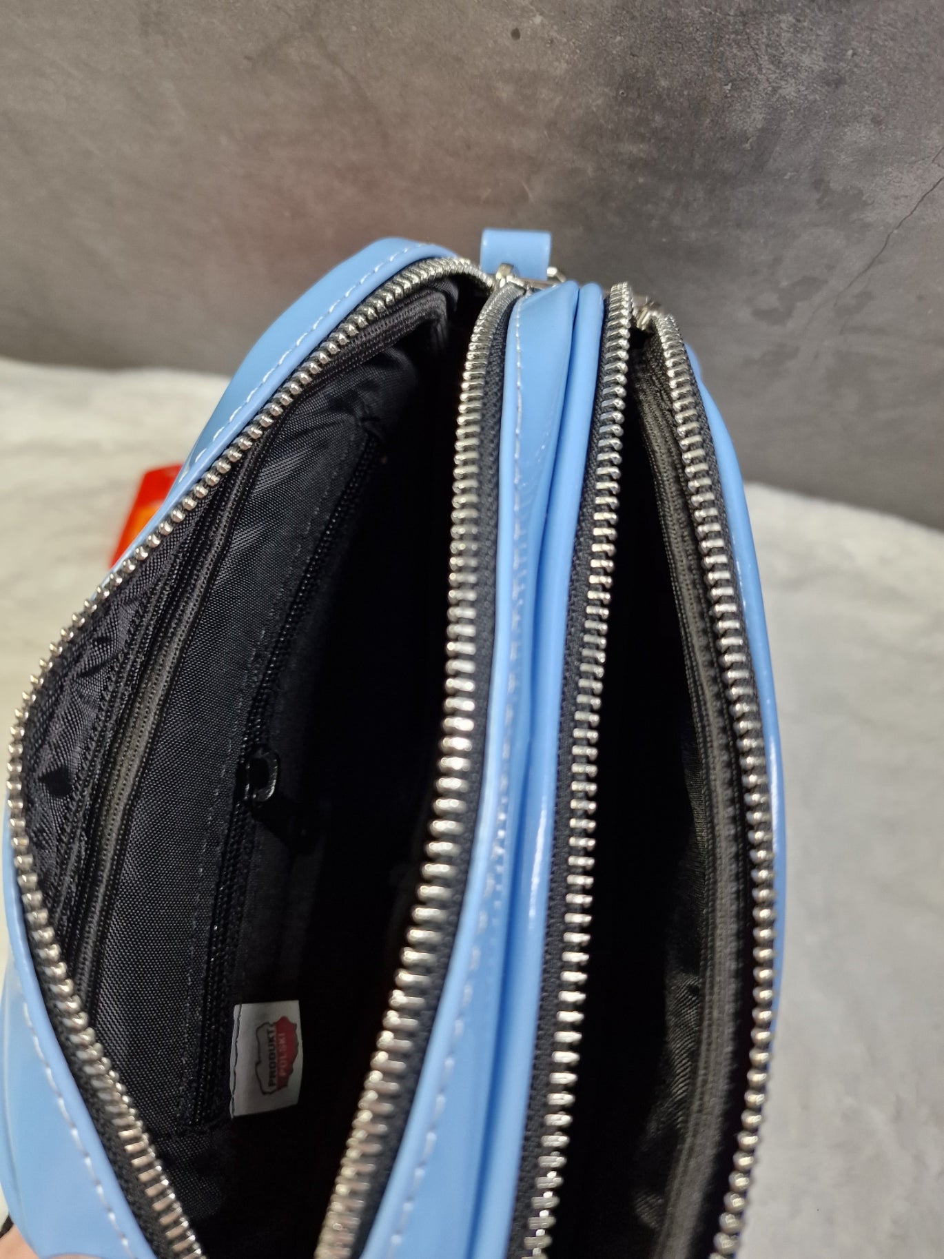 Laura Biaggi small, cross body bag in blue image 2