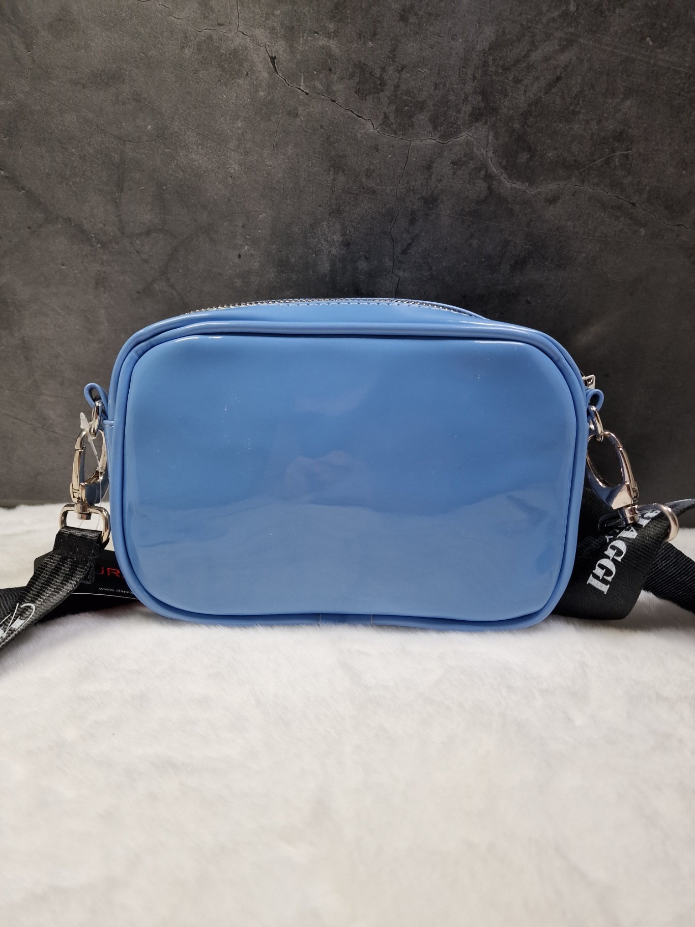 Laura Biaggi small, cross body bag in blue image 1
